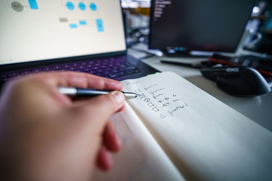 A notebook and checklist on a desk