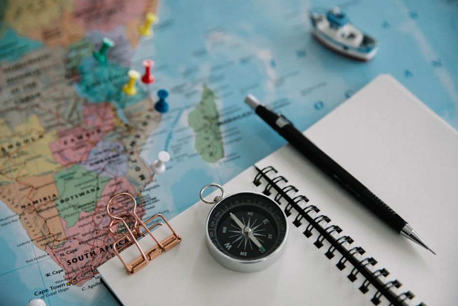 A map and notebook laid out for planning